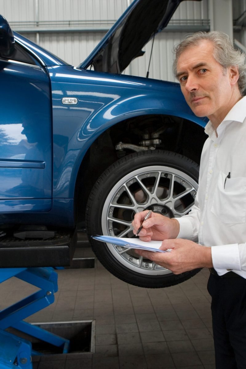 portrait-of-manager-with-clipboard-in-auto-repair-2026-01-11-09-44-27-utc